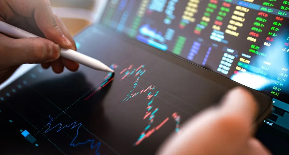 Stock market chart displayed on a laptop screen, showing trends and fluctuations in financial data.
